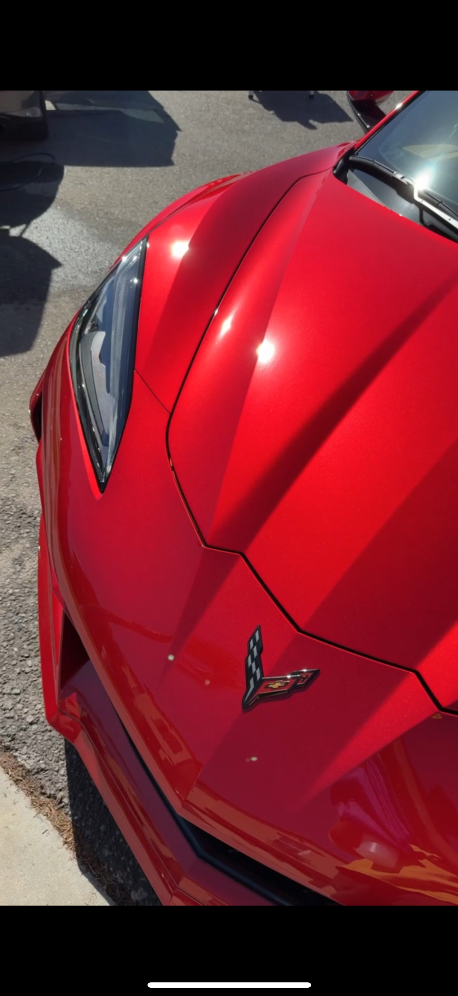 Glossy red Corvette paint finish after detailing