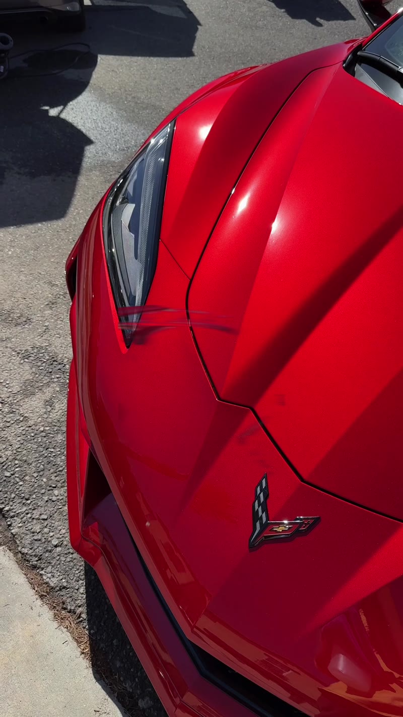 Glossy red Corvette after a mobile detail
